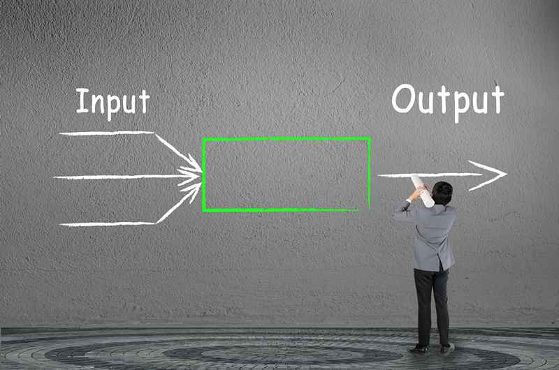 businessman drawing input output concept